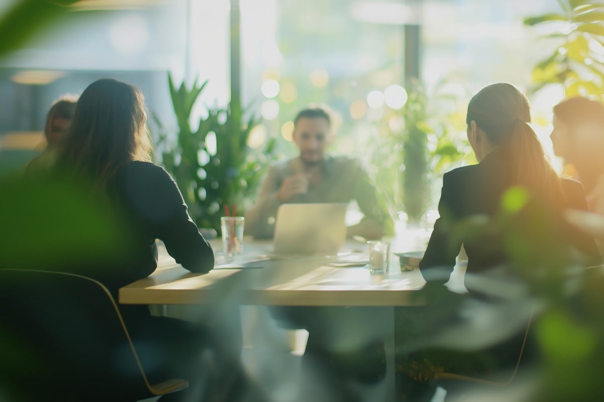 AdobeStock_1009450664_Team of business professionals having a  productive meeting 1200x800